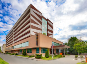 Avanti hotel building under blue sky with clouds