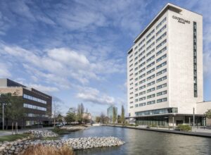 View of the Courtyard by Marriott hotel building with the lake in front