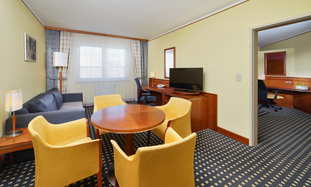 Hotel room with yellow armchairs at Quality hotel