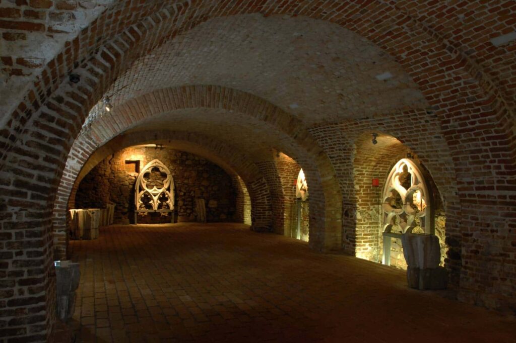 A passage in the Brno underground with illuminated niches