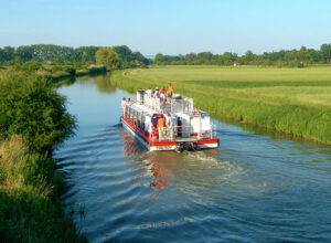 Cruise on a boat along the Bata Canal, photographed from behind