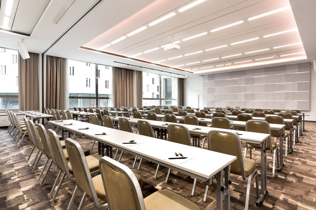 A conference room in the Best Western International hotel with a school-style meeting arrangement from the side