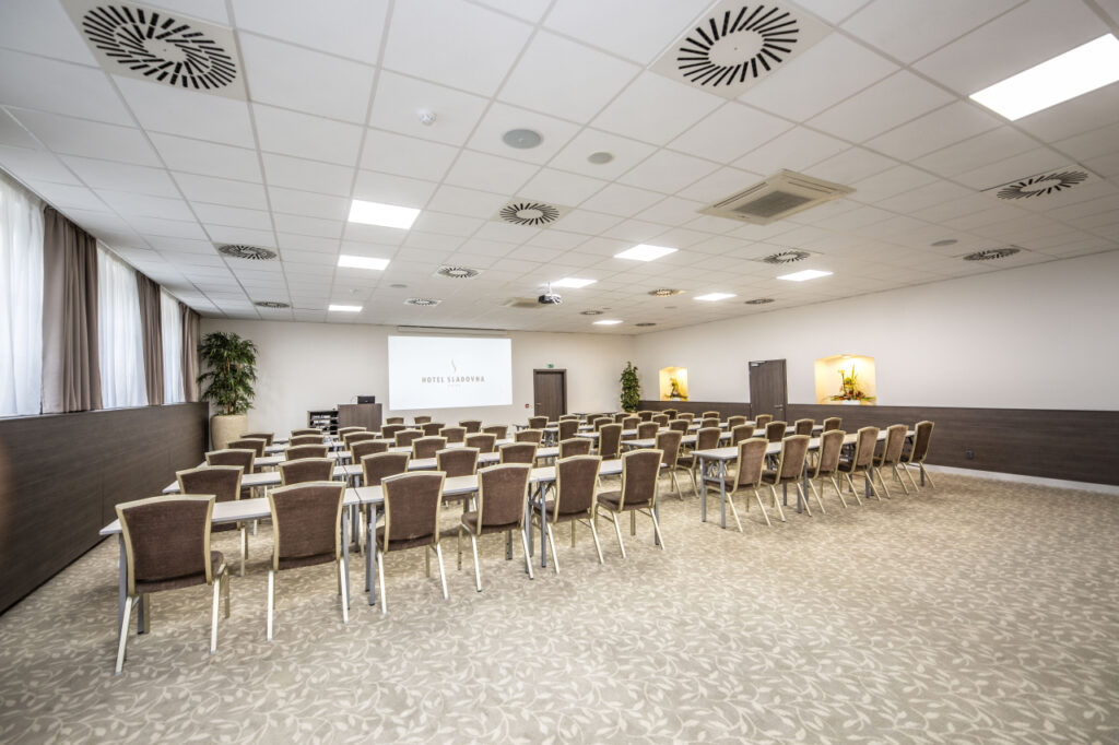 Conference room with theater-style seating arrangements in Sladovna hotel