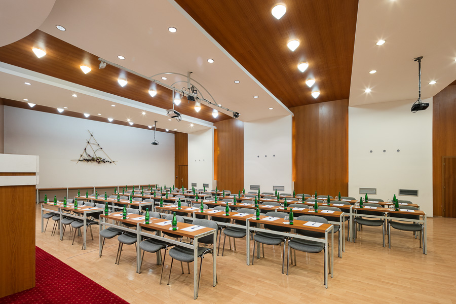 A conference room in the Amande Hotel with a school-style layout
