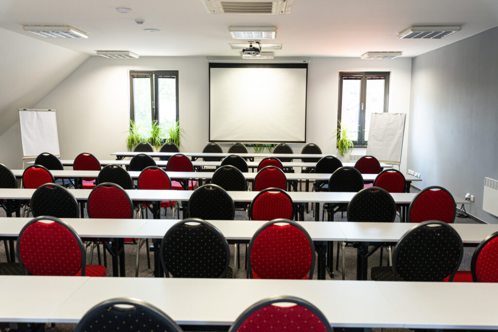 A school-style seating in conference room at the Chateau de Frontiere