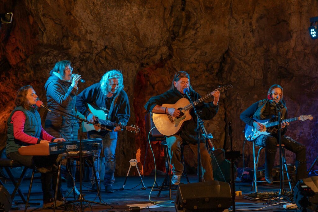Concert of the music band in the cave